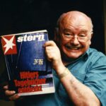 Konrad Kujau, a late middle-aged bald white man with glasses, holds the Stern news magazine that says "Hitlers Tagebucher entdekr"